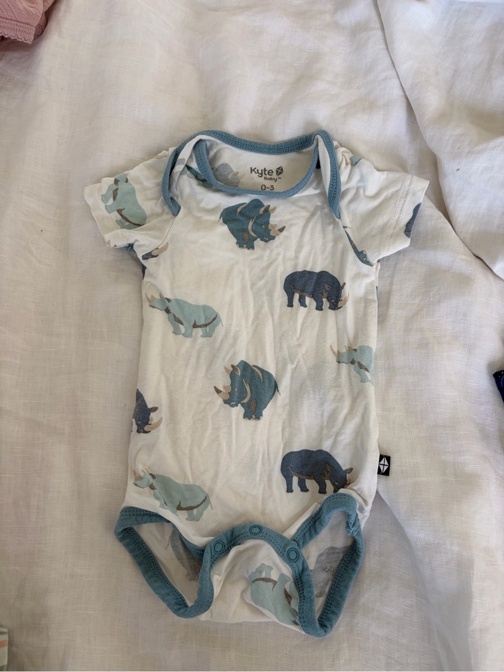 Kyte BABY White One-Piece with Blue and Teal Rhino Print